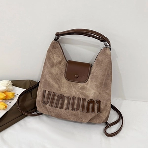 Retro brown textured canvas hobo shoulder bag with leather strap on minimalist background