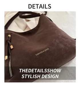Detail of dark brown matte tote bag with side metal zipper and Fashion & Bags logo