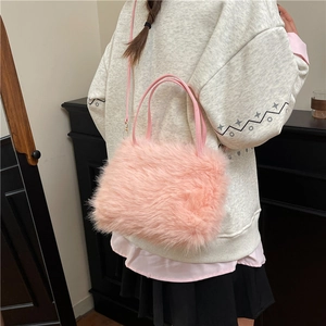 Chic pink faux fur handbag with leather straps and detachable shoulder strap for women