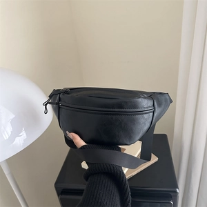 Minimalist black PU leather half-moon crossbody bag with adjustable wide strap for women