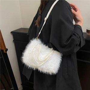 Elegant white faux fur handbag with gold hardware and plush texture for winter fashion