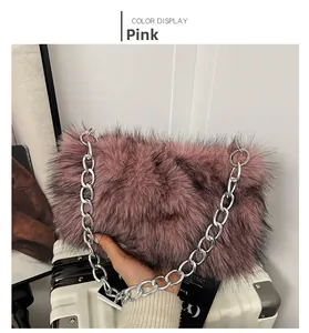 Detailed view of a pink plush faux fur bag featuring a chunky silver metal chain strap