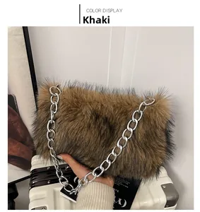 Detail of khaki faux fur handbag texture with chunky silver chain and plush material