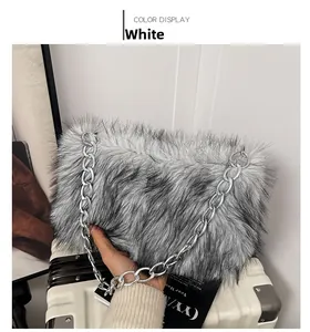 Detail of faux fur shoulder bag in greyish white with thick metal chain strap