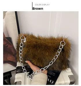 Detailed view of brown plush faux fur bag with chunky silver metal chain strap