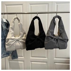 Detailed comparison of corduroy tote bags with bow design in beige, black, and gray