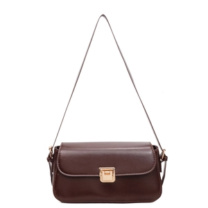 Minimalist retro dark brown underarm bag with gold metal lock on a white background