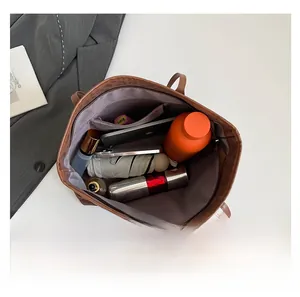 Interior view showing the large capacity and zippered pocket of this leather tote bag