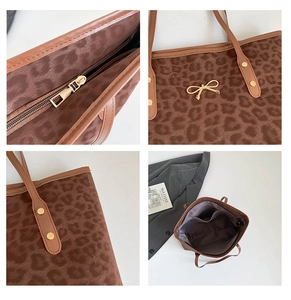 Macro details of leopard print tote showing zip top, gold bow, and spacious interior