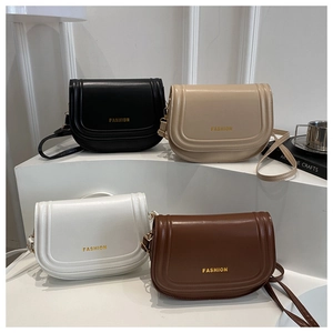 Macro detail of high-quality saddle bags in four colors with gold fashion logo