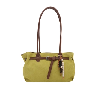 Retro mustard yellow tote bag with suede texture and brown tassels for women