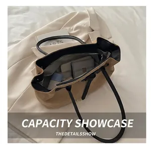 Interior view showing the large capacity of the brown suede tote bag with daily items