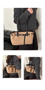 Close-up of khaki suede tote bag with black leather straps and wooden bead tassel detail
