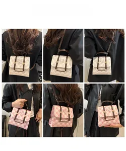 Detail view of mini plaid backpack with cartoon prints and dual-use handles