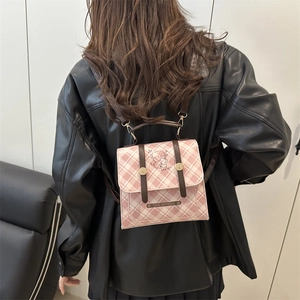 Chic pink plaid mini backpack for women featuring a cute puppy design and brown straps