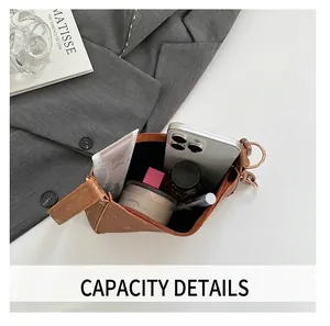 Internal view of brown leather handbag showing spacious capacity for phone and cosmetics