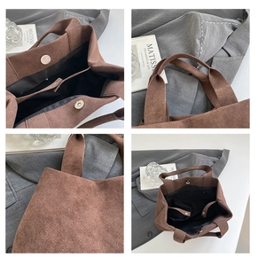 Close-up of brown suede tote bag featuring magnetic closure and internal dividers