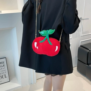 Fashionable cherry-shaped red plush crossbody bag with green leaf detail and gold chain