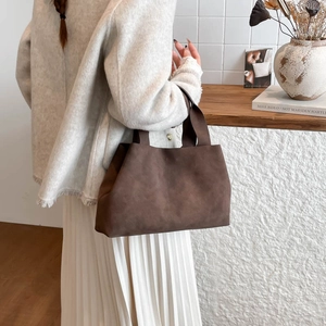 Minimalist large brown suede tote bag for women, ideal for elegant daily commuting style