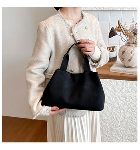 Close-up of minimalist black matte tote bag showing its premium texture and large capacity