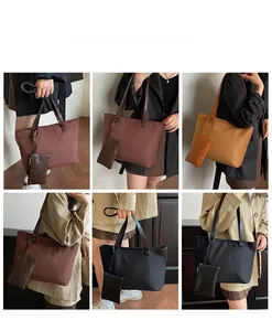 Detail view of large suede tote bags with matching pouches in coffee and khaki colors