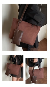 Detail view of large dark brown tote bag with matching pouch on model in minimalist style