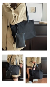 Detail of minimalist black nylon tote bag set with matching small zipper pouch
