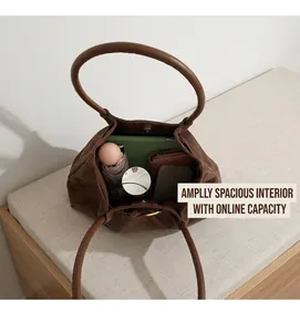 Top view of large brown suede tote bag showing spacious interior with daily essentials