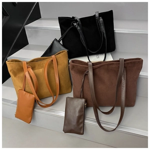 Three-piece suede tote bag set in black, camel and brown with matching zip pouches