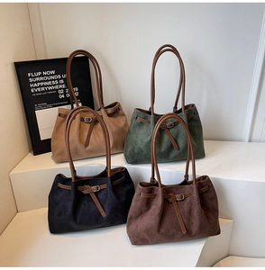 Detail view of large tote bags in four retro matte colors on minimalist display