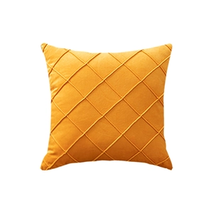Square mustard yellow velvet pillow cover with modern diamond quilted texture on white background