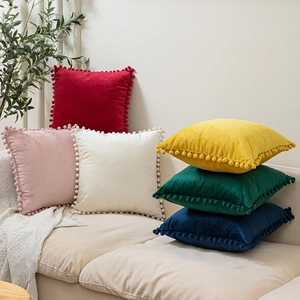 Velvet square throw pillow covers with decorative pom-poms in six vibrant colors