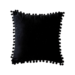 Solid black velvet pillow cover with decorative pom-pom trim for sofa and home decor