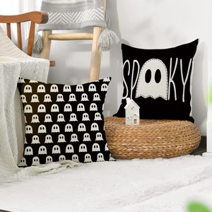 Set of two black and white Halloween ghost pillow covers with SPOOKY text on linen fabric