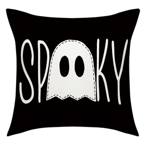 Detail of linen Halloween pillowcase with white ghost print and spooky typography