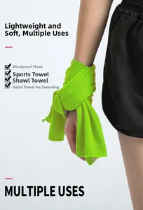 Close-up of fluorescent green cooling towel used as a sweatband on a runner's wrist