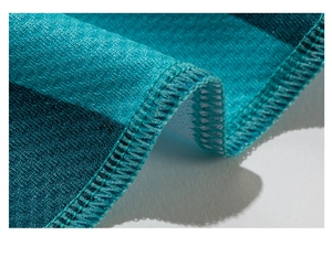 Macro shot of precise edge stitching and texture on cooling sports towel fabric