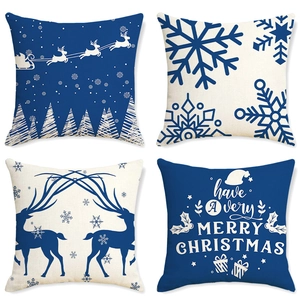 Détail de 4 housses de coussin de Noël en lin avec motifs Père Noël, renne et flocons