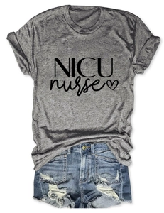 Flat lay of gray NICU Nurse T-shirt with heart print and distressed denim shorts