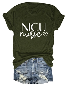 Detail of dark green NICU nurse t-shirt with heart print paired with denim shorts