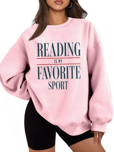 Detail of pink sweatshirt with Reading Is My Favorite Sport slogan and ribbed collar