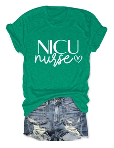 Flat lay of green NICU Nurse heart print t-shirt paired with distressed denim shorts