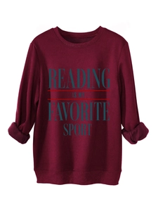 Detailed view of the ribbed cuffs and slogan on the maroon Reading Is My Favorite sweatshirt