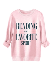Detail of pink sweatshirt with Reading Is My Favorite Sport text and ribbed cuffs