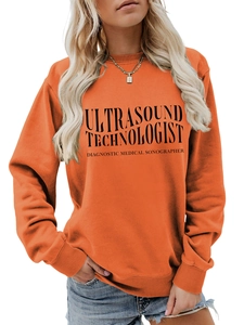 Detail eines orangen Sweatshirts mit schwarzem Ultrasound Technologist Aufdruck