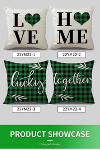 Close-up of four linen St. Patrick's Day pillow covers with green clover patterns