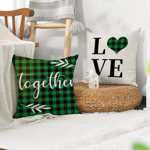 Set of St. Patrick's Day linen pillow covers with LOVE and Together prints on white rug