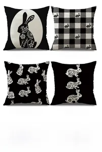 Grid view of four vintage Easter rabbit linen pillow covers with black and white patterns