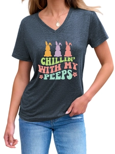 Detail of V-neck dark grey t-shirt featuring colorful bunny silhouettes and festive text