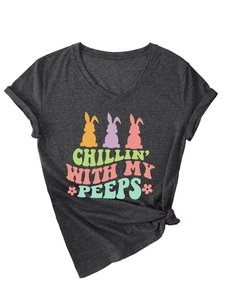 Detail of V-neck dark grey t-shirt featuring colorful Easter bunny graphics and tied knot